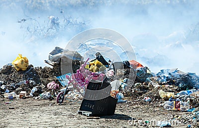 Burning pile of garbage, cause of air pollution. Pollution concept. Rubbish Editorial Stock Photo