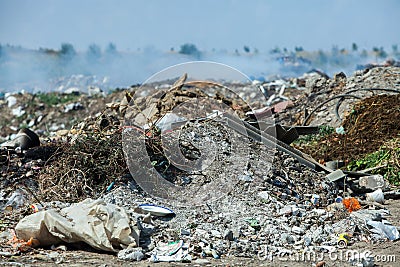 Burning pile of garbage, cause of air pollution. Pollution concept. Rubbish Editorial Stock Photo