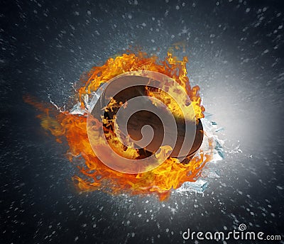 Burning puck with shards of ice on abstract background Stock Photo