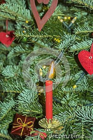 Burning christmas candels at the christmas tree Stock Photo