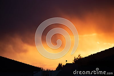 Burning sky. Sunset early evening and view from the window at home. Stock Photo