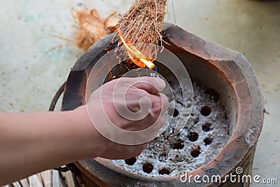 Burning and smoking coconut peel. Stock Photo