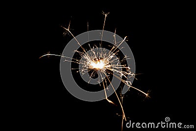 Burning sparkler isolated on black background. Fireworks theme. Light effect and texture Stock Photo