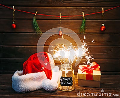 Burning sparklers in a New Year`s glass jar. Stock Photo