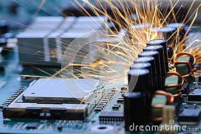 Burning sparks fly from a circuit chip Stock Photo