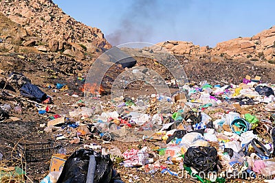 Trash piles at an improvised and illicit dump site. Editorial Stock Photo