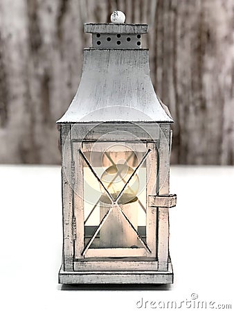 Burning vintage lamp on a gray-white background. Stock Photo