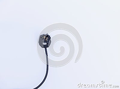 Burnt out electric plug showing fuse with black wire still attached Stock Photo