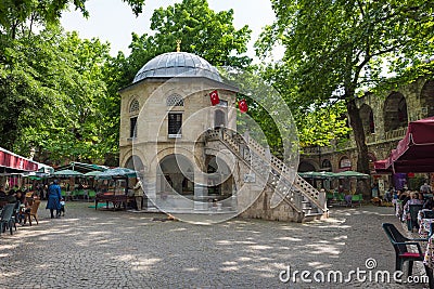 Koza Han Bursa tea garden with a small mosque, Turkey Editorial Stock Photo