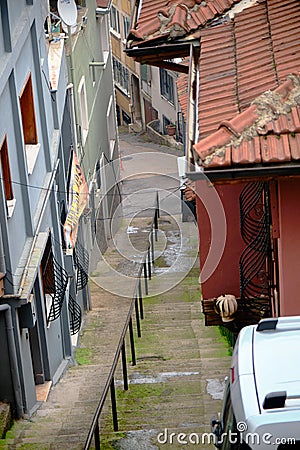 Narrow street and old houses roof made of red bricks in bursa. Editorial Stock Photo