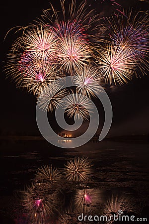 Bursts of Orange and Pink Fireworks Stock Photo