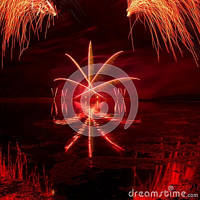 Bursts of Red Fireworks Stock Photo