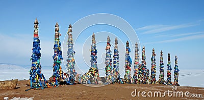 Buryat shamans sacred place. Wooden poles with ribbons Stock Photo