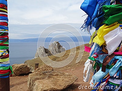 Buryat traditional pagan holy poles with colorful ribbons by the Lake Baikal Stock Photo