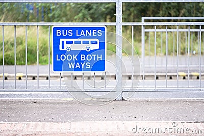 Bus lanes sign in city with look both ways warning Stock Photo