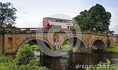 A Bus on an Old Bridge in England Editorial Stock Photo