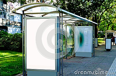 bus shelter at bus stop. blank lightbox billboard ad sign. white poster space. Stock Photo