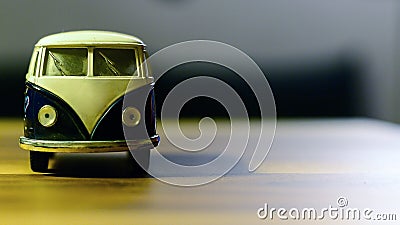 Bus toy on wooden background oriented on the side type cleavage available Stock Photo
