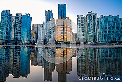 Busan cityscape at nighttime with reflection at Haeundae beach. Editorial Stock Photo