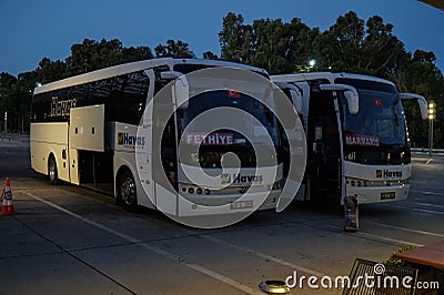 Buses are parked near Dalaman airport awaiting tourists. Editorial Stock Photo
