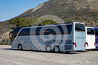 Buses parked on a parking lot waiting in a hot summer weather for the tourists Stock Photo