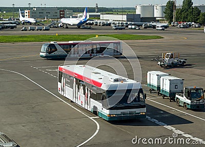 Buses for passengers traveling on the airfield of Domodedovo Airport Editorial Stock Photo