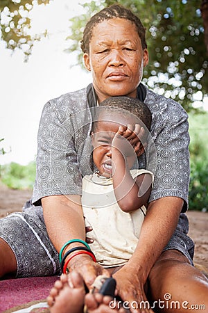 Bushman granny with child Stock Photo