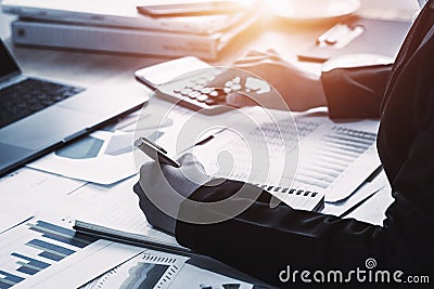 business accounting finance concept. accountant using calculator for calculate with laptop working in office Stock Photo