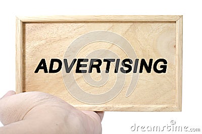 Business and advertising concept. hand holding plain wood with word advertising Stock Photo