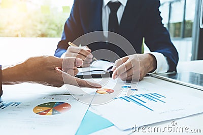 Business advisor analyzing financial figures denoting the progress in the work of the company Stock Photo