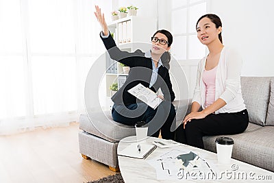 Business agent with client visiting house building Stock Photo