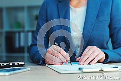 Business agreement signing, businesswoman handwriting signature Stock Photo