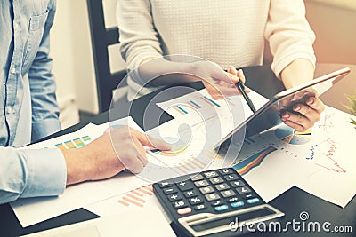 Business analysis - people discussing financial graphs at office Stock Photo