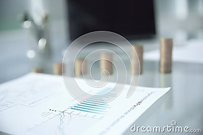 Business background. financials and stacks of coins on the office Desk Stock Photo