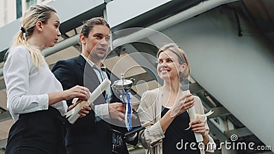 Business background of business people in business wear are cheerful for being winner in business competition contest with hand Stock Photo