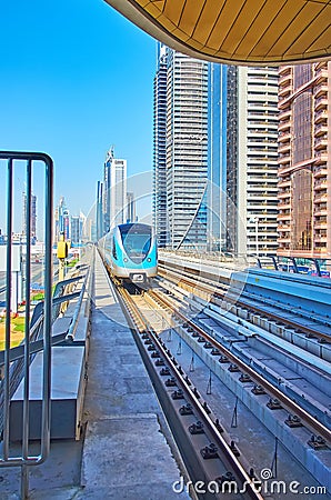 Business Bay Metro Station and riding train, on March 6 in Dubai, UAE Editorial Stock Photo