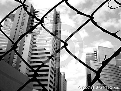 Business behind fence Stock Photo