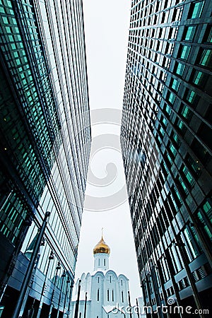 Business buildings skyline looking up with sky and churche, high-rise buildings, modern architecture Stock Photo