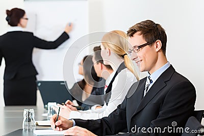 Business - businesspeople, meeting and presentation in office Stock Photo