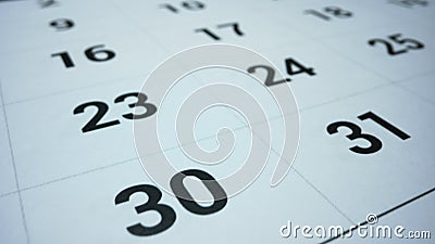 Business calendar for event planning. Female hand marking date on calendar Stock Photo