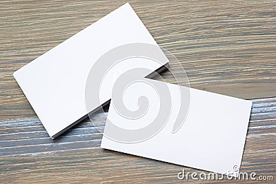 Business card blank over office table. Corporate stationery branding mock-up Stock Photo