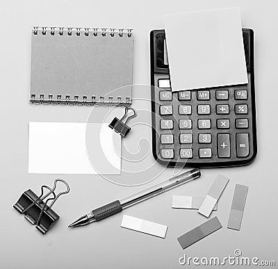 Business card with empty space and binders near sticky notes. Stationery and calculator. Office supplies and business Stock Photo