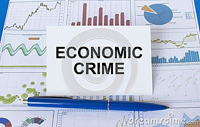 Business card with text Economic Crime laying on financial graphs Stock Photo