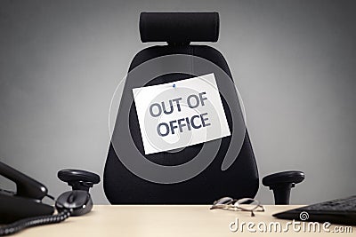 Business chair with out of office sign Stock Photo