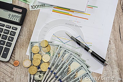 Business charts, euros, dollars, calculators and coins. View from above Stock Photo