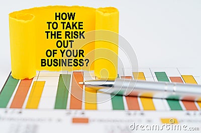 On the business charts are a pen and a paper plate with the inscription - How To Take the Risk Out of Your Business Stock Photo