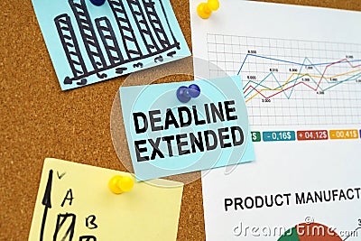 Business charts and stickers with the inscription hang on the board - DEADLINE EXTENDED Stock Photo