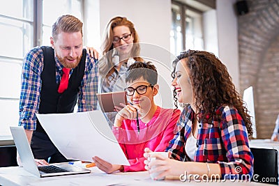 Business coworkers celebrate achieved goals in office Stock Photo