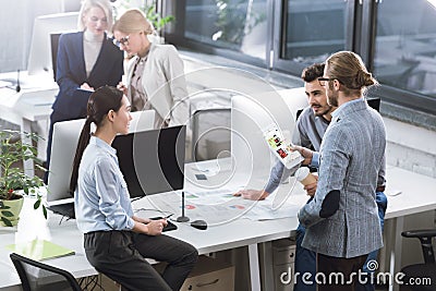 selective focus of business colleagues discussing new idea together at workplace Editorial Stock Photo