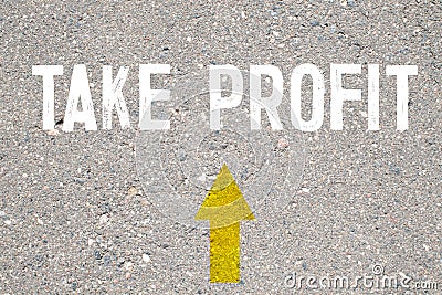 Business concept. On the asphalt road markings an arrow with the inscription - TAKE PROFIT Stock Photo